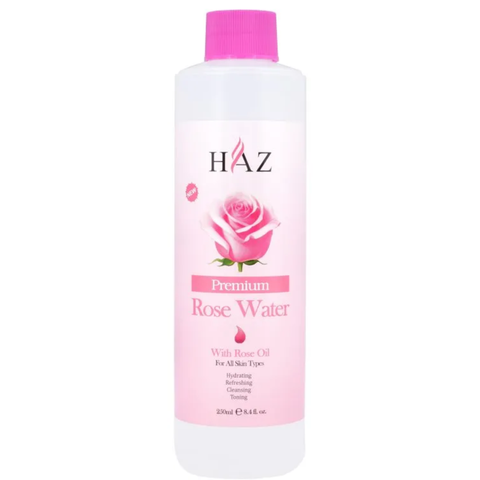 HAZ Premium Rose Water bottle with a pink cap and a pink label featuring a rose graphic, on a white background.